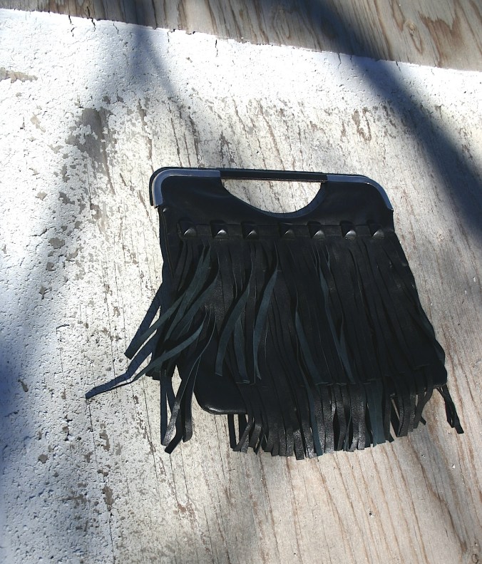 bag with studs and fringes