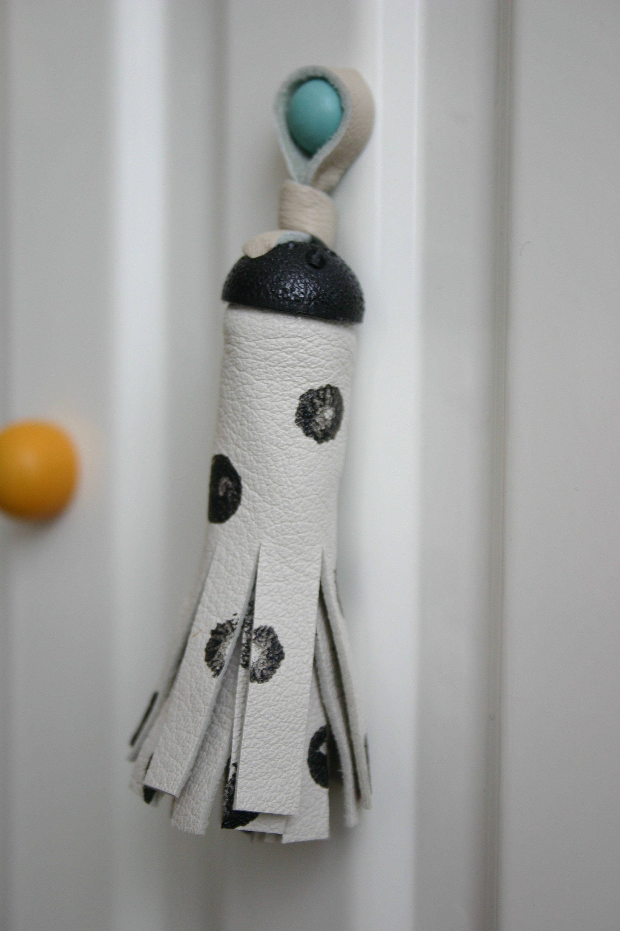 diy white leather tassel with dots and old button