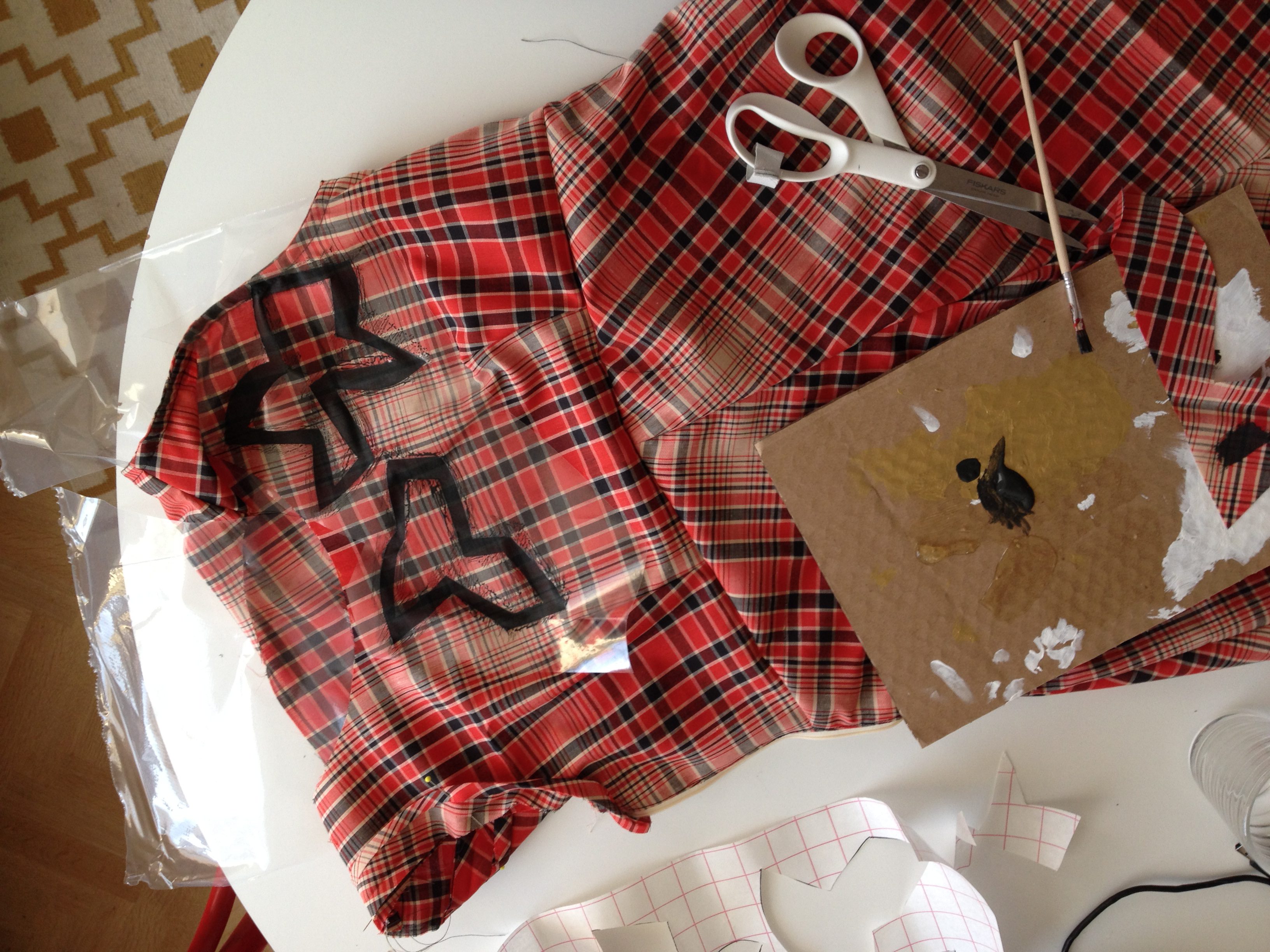 stamping free hand cut shapes on the dress