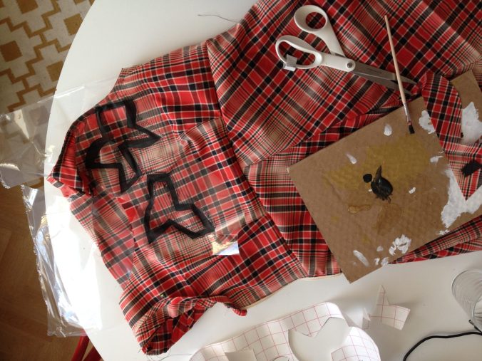 stamping free hand cut shapes on the dress