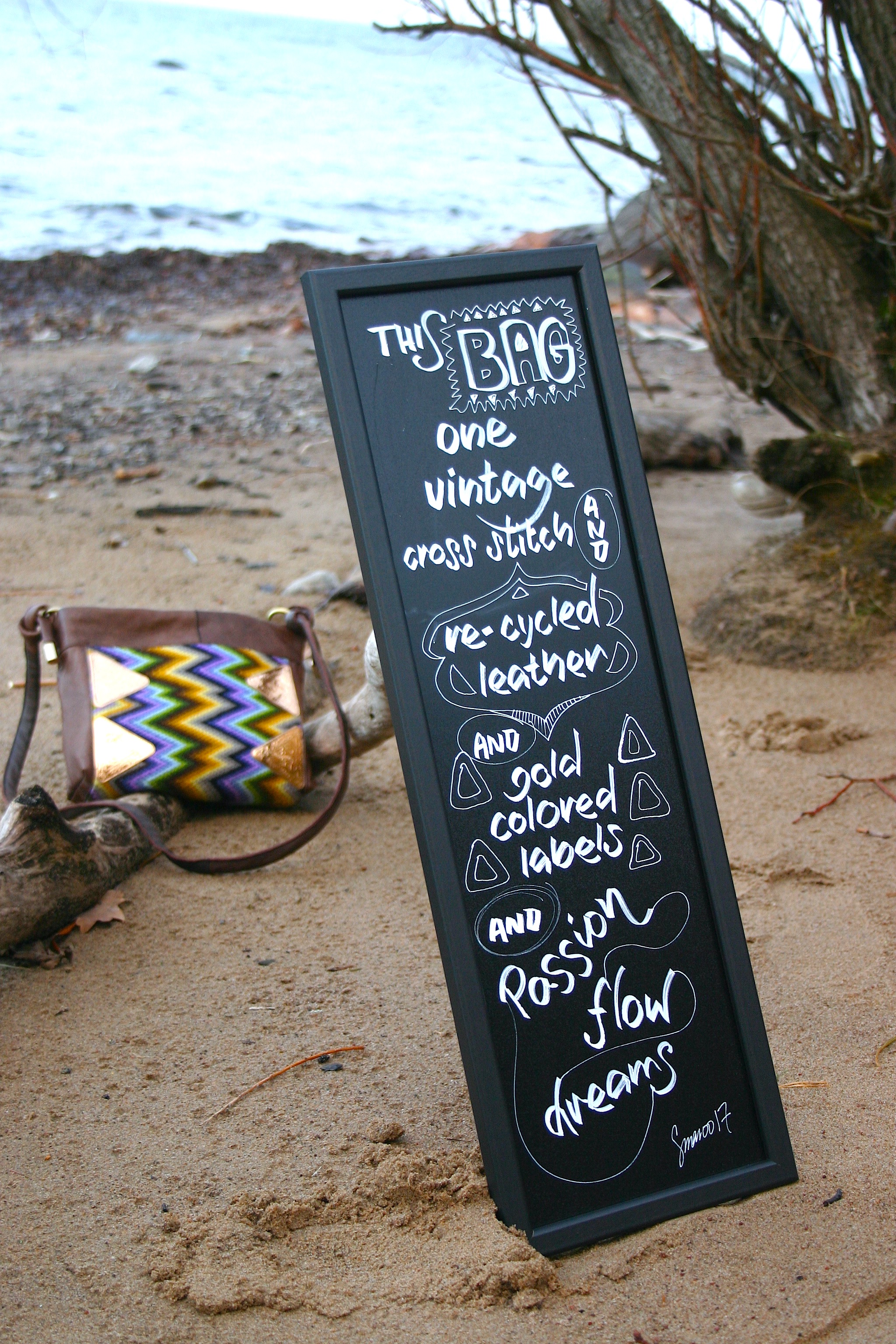 diy bag photoshoot by the waterside with hand lettered board