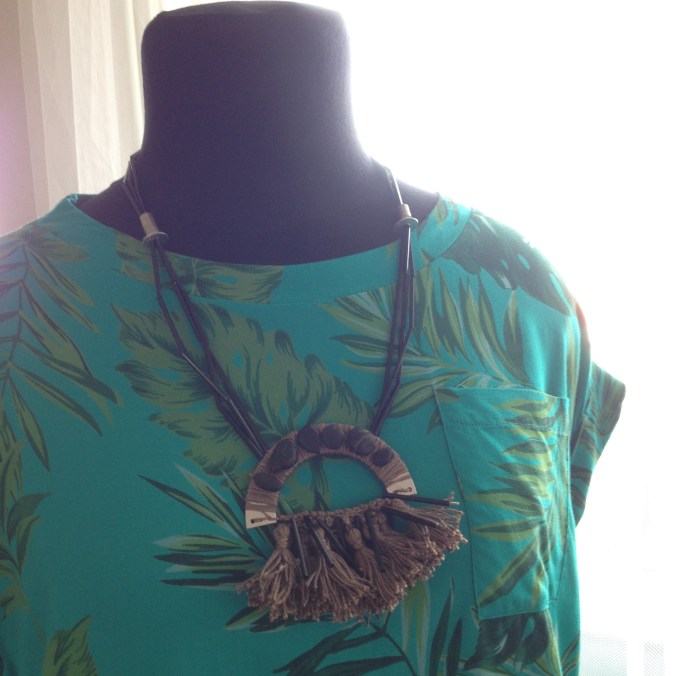 diy neckpiece with sand colored thread and beach stones